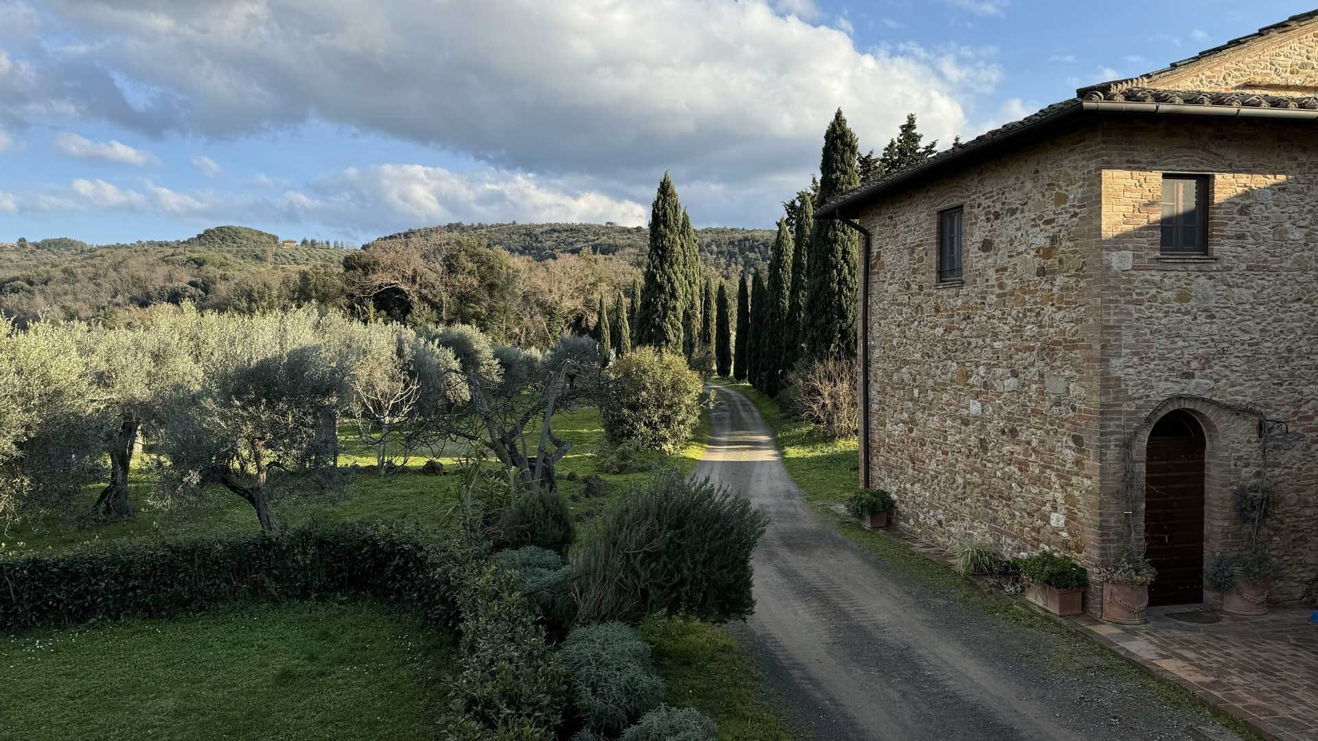 Soiano luxury agriturismo in the Tuscan hills — panoramic view of the estate at sunset